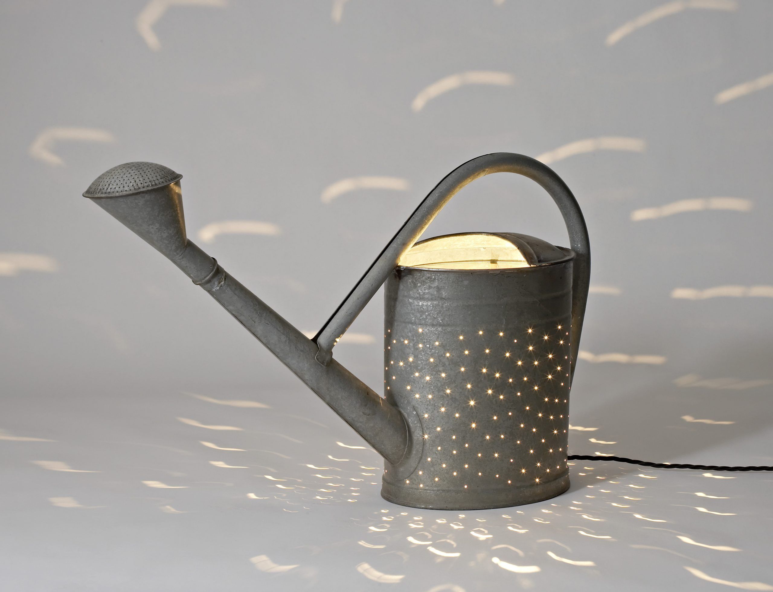 © Rolf Sachs Pouring Light Watering Can courtesy ammann gallery